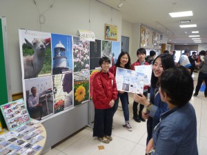 4 students in front of the booth